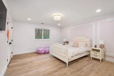 a view of a hallway with entryway wooden floor and front door