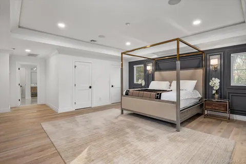 a bathroom with a double vanity sink mirror and toilet