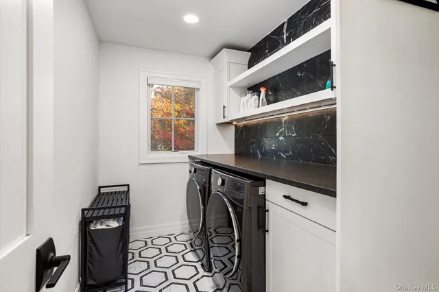 a bedroom with a bed and a mirror