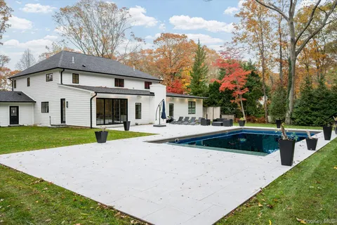 a bathroom with a sink mirror and a bathtub