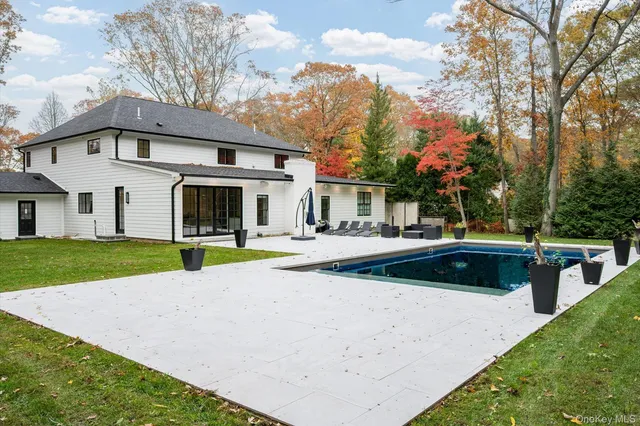 a bathroom with a sink mirror and a bathtub