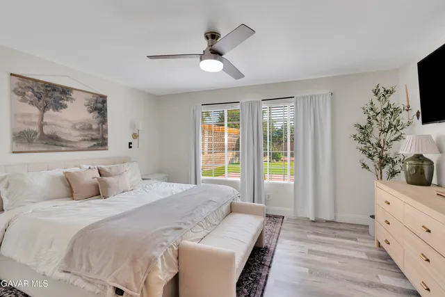 a bedroom with a large bed and a window