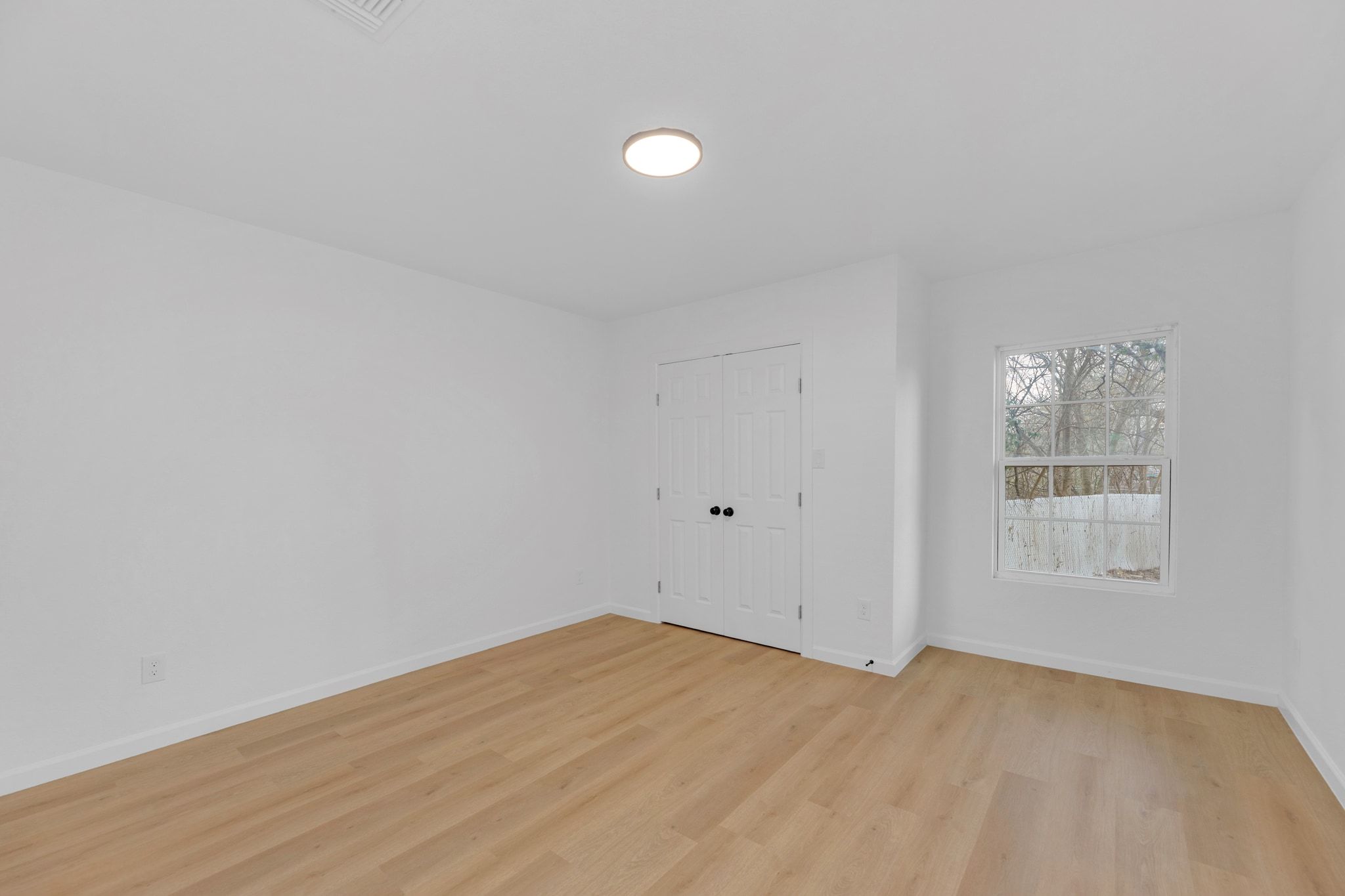 1709 Cecelia Street Taylor, TX 76574 - Photo 24 of 37 Empty room featuring baseboards and light wood-type flooring