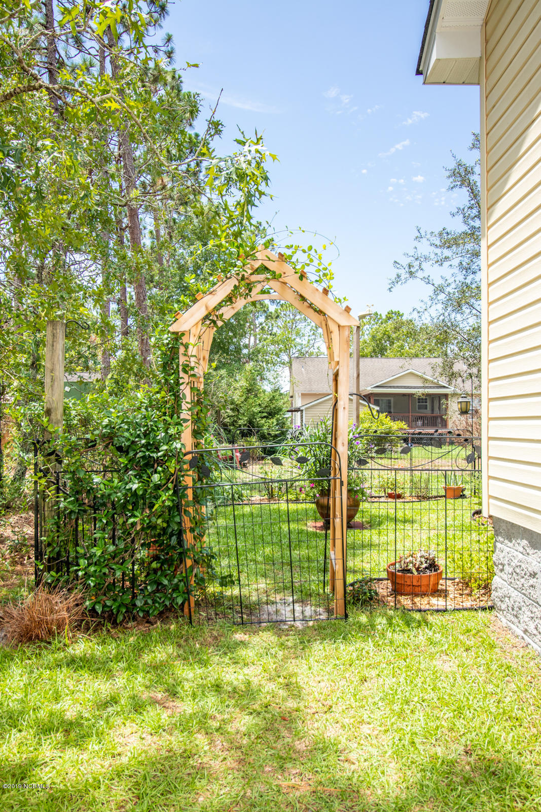 323 Cedar Road Southport, NC 28461 - Photo 4 of 30 Arbor to back yard