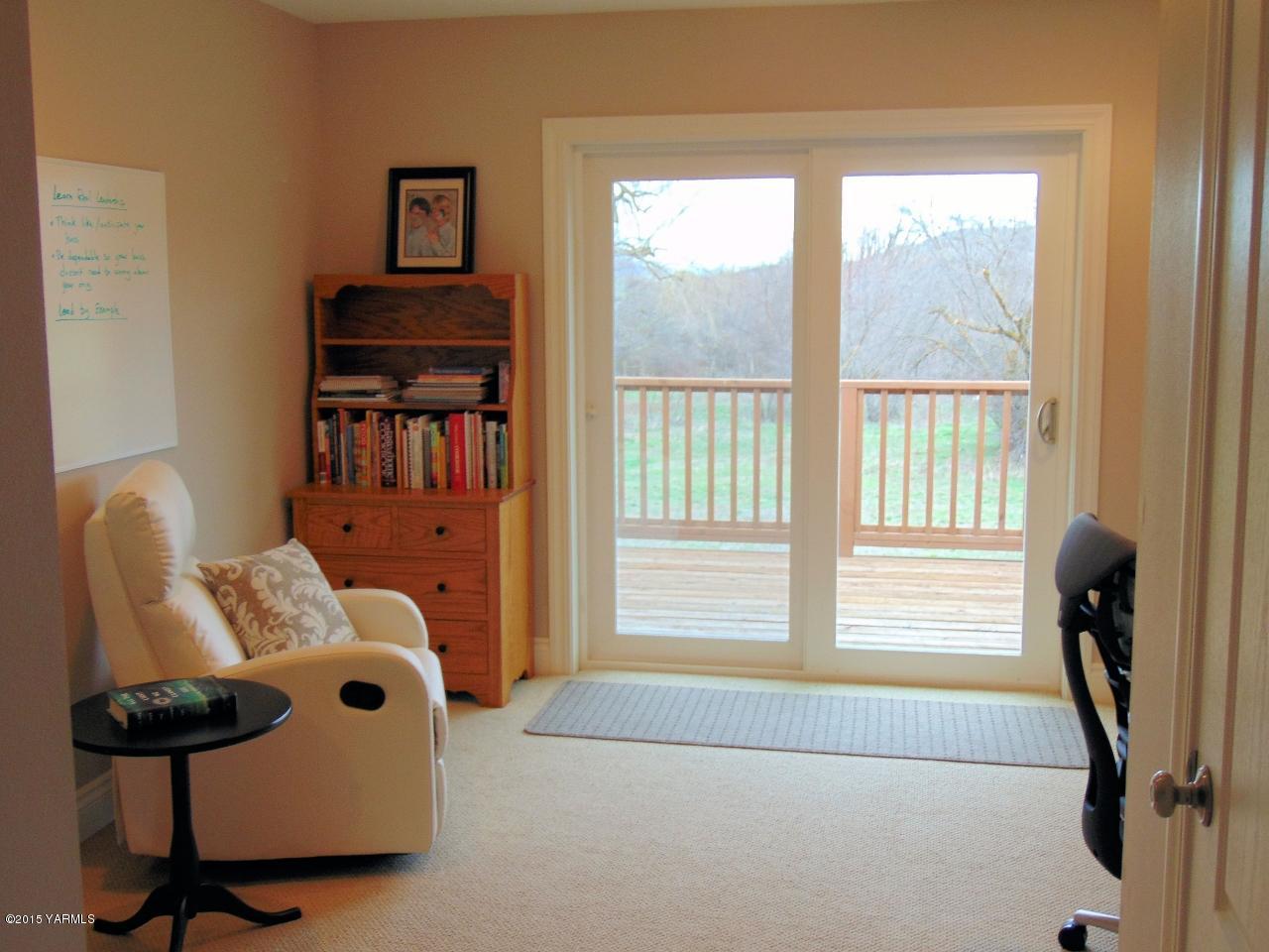 3801 Wiley Road Yakima, WA 98903 - Photo 12 of 20 a bedroom with furniture and a window