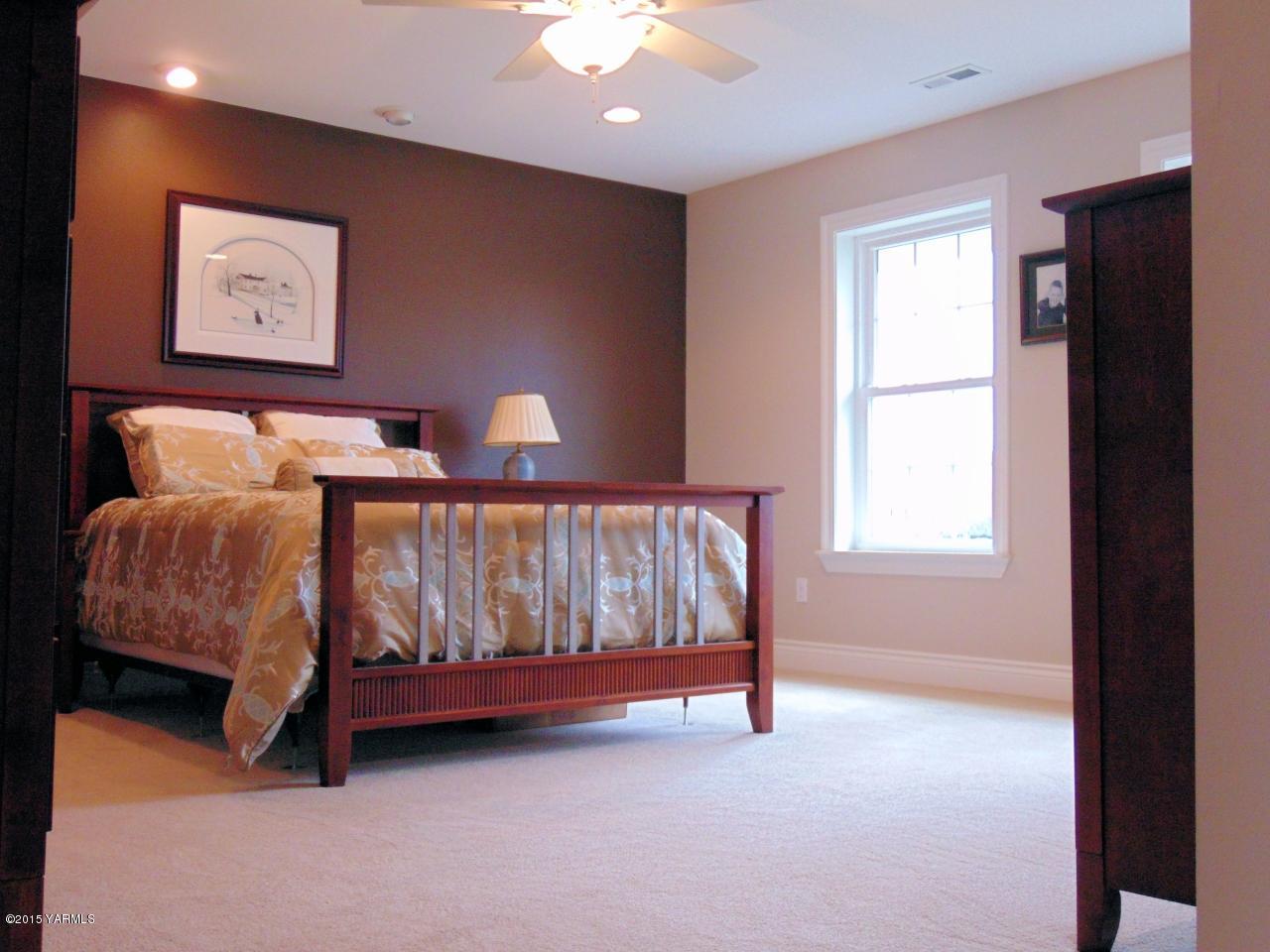 3801 Wiley Road Yakima, WA 98903 - Photo 13 of 20 a bed sitting in a room next to a window