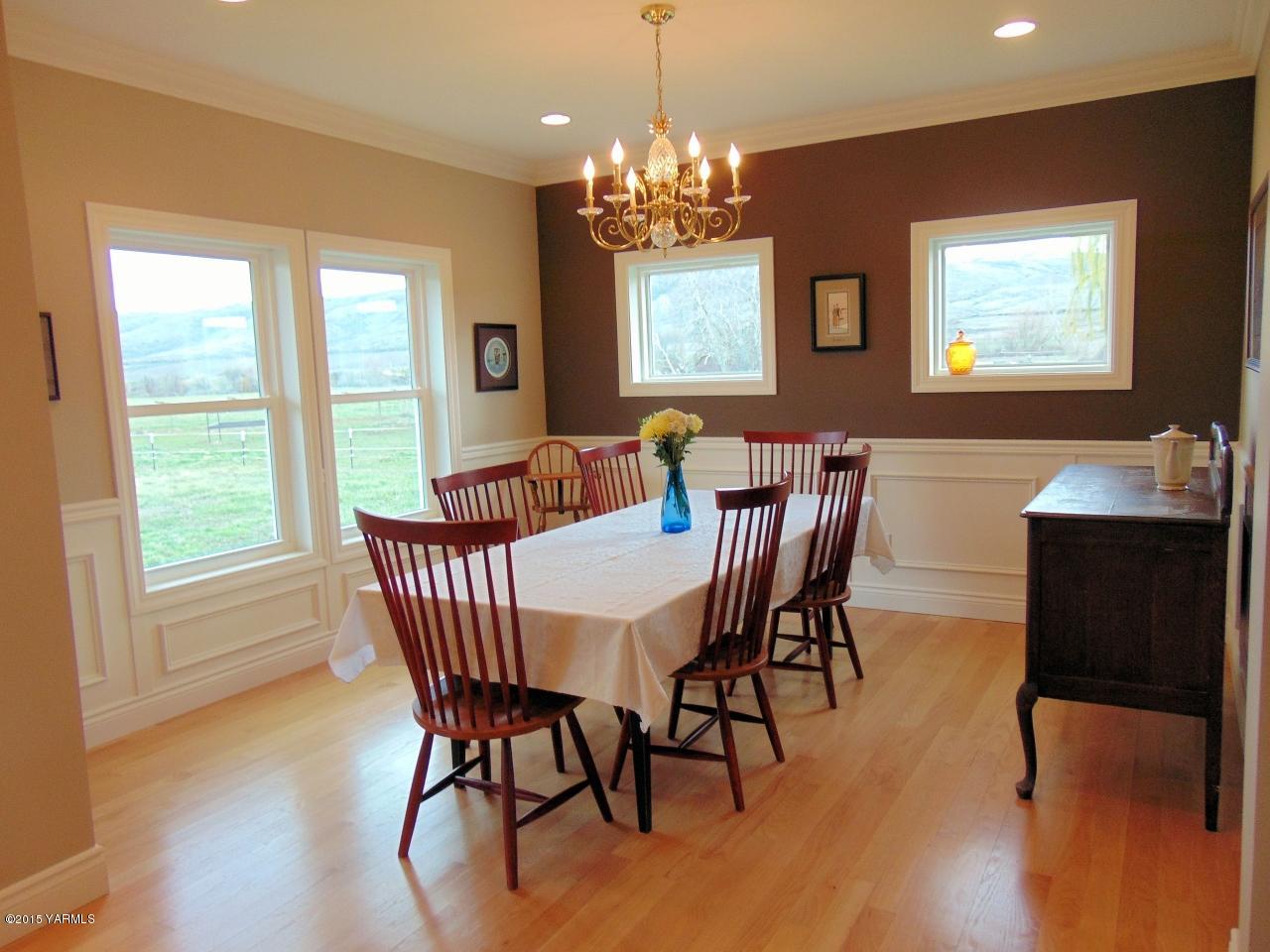 3801 Wiley Road Yakima, WA 98903 - Photo 17 of 20 a view of a dining room with furniture window and wooden floor