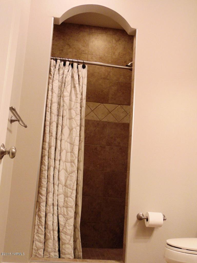 3801 Wiley Road Yakima, WA 98903 - Photo 18 of 20 a bathroom with a shower and a toilet