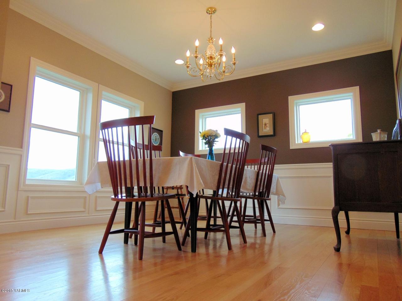 3801 Wiley Road Yakima, WA 98903 - Photo 5 of 20 a view of a dining room with furniture window and wooden floor