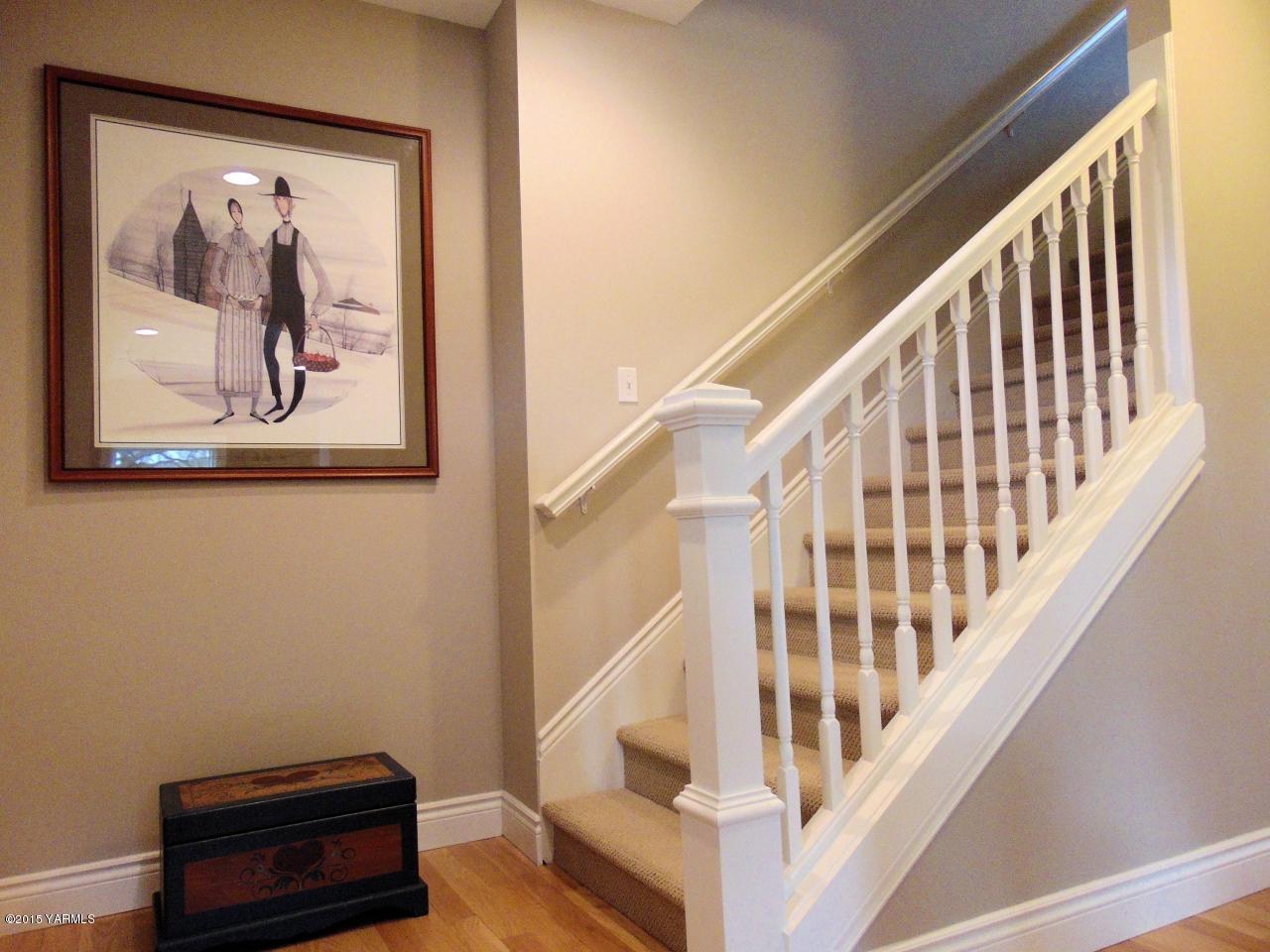 3801 Wiley Road Yakima, WA 98903 - Photo 6 of 20 a view of staircase with wooden floor and a rug