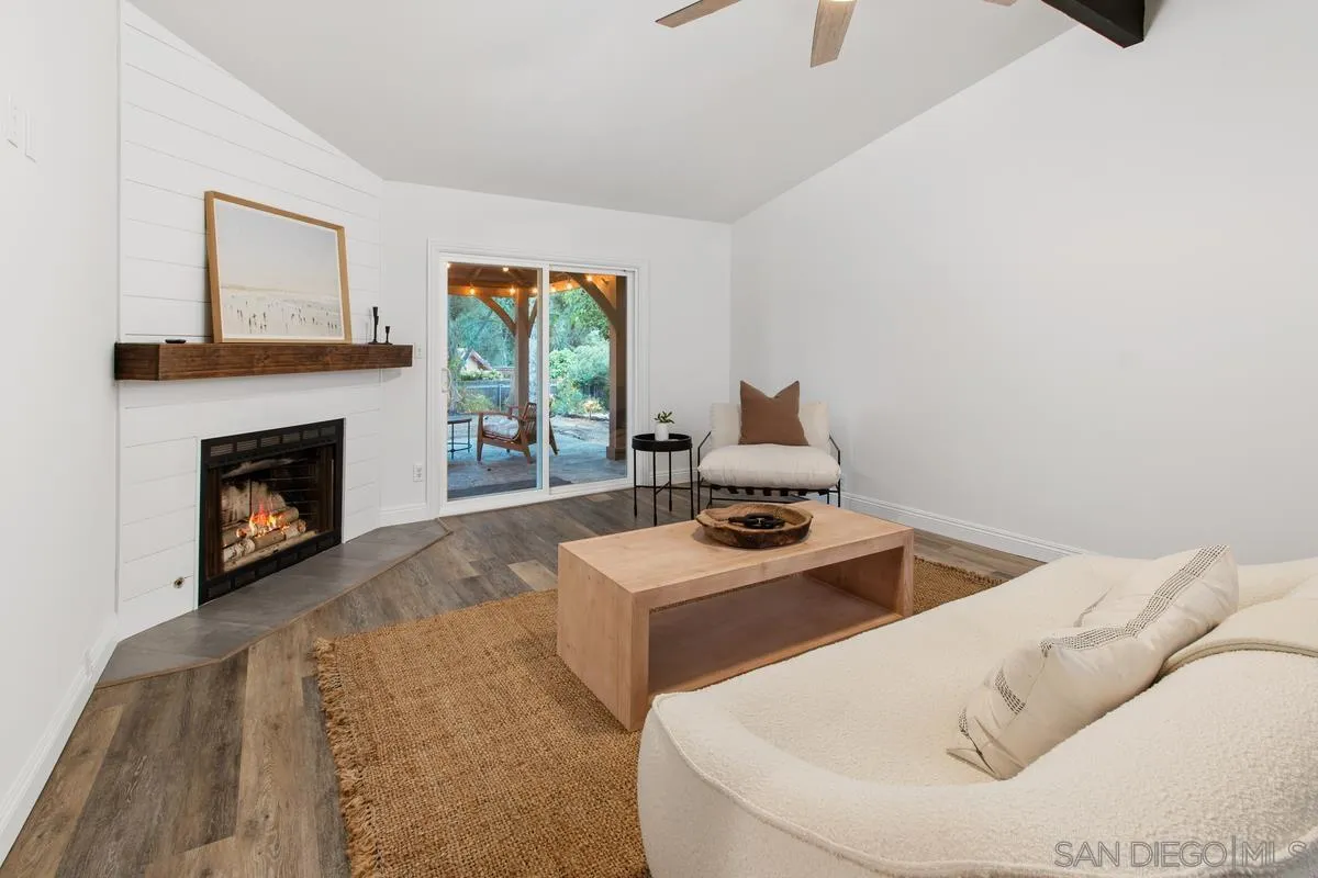 16852 Orchard Bend Road Poway, CA 92064 - Photo 16 of 39 a living room with furniture and a fireplace