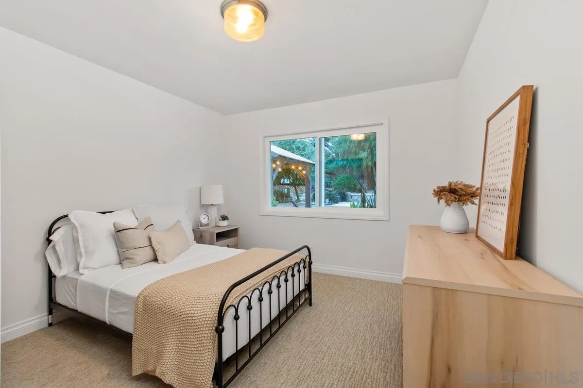 16852 Orchard Bend Road Poway, CA 92064 - Photo 17 of 39 a bedroom with a bed and a window