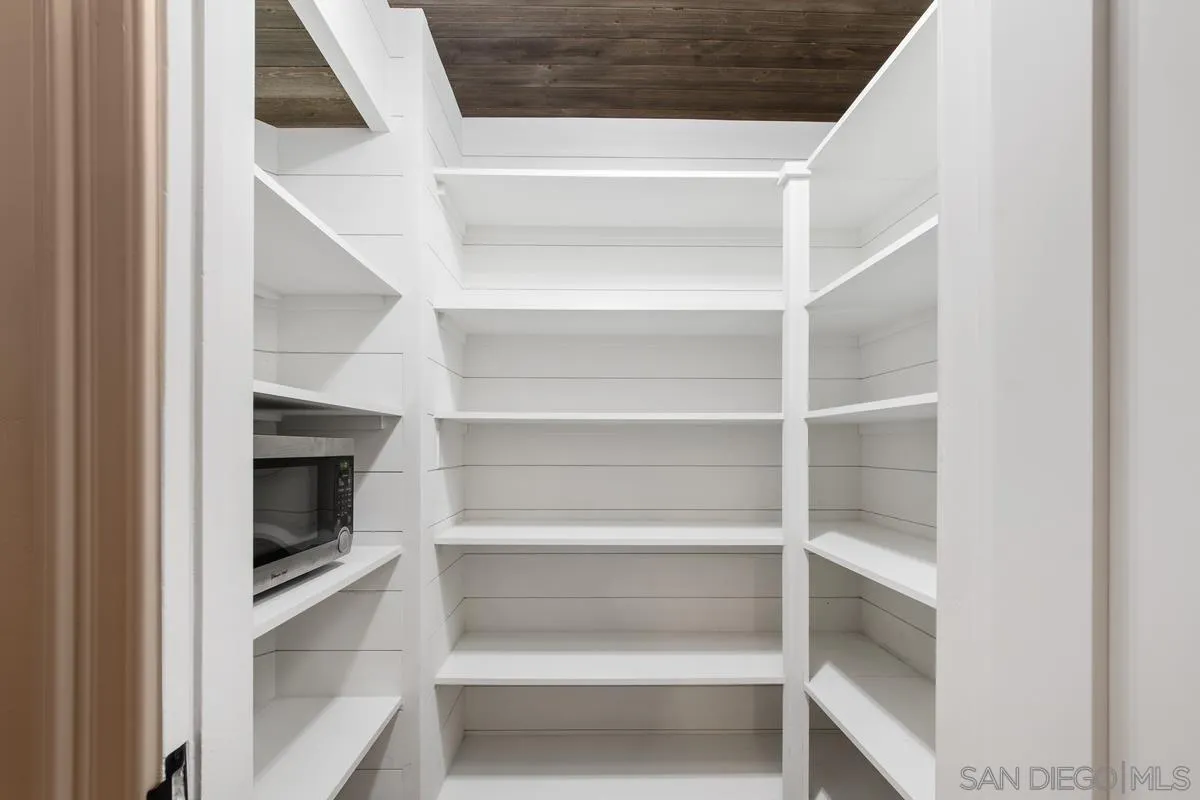 16852 Orchard Bend Road Poway, CA 92064 - Photo 26 of 39 a view of walk in closet with empty racks