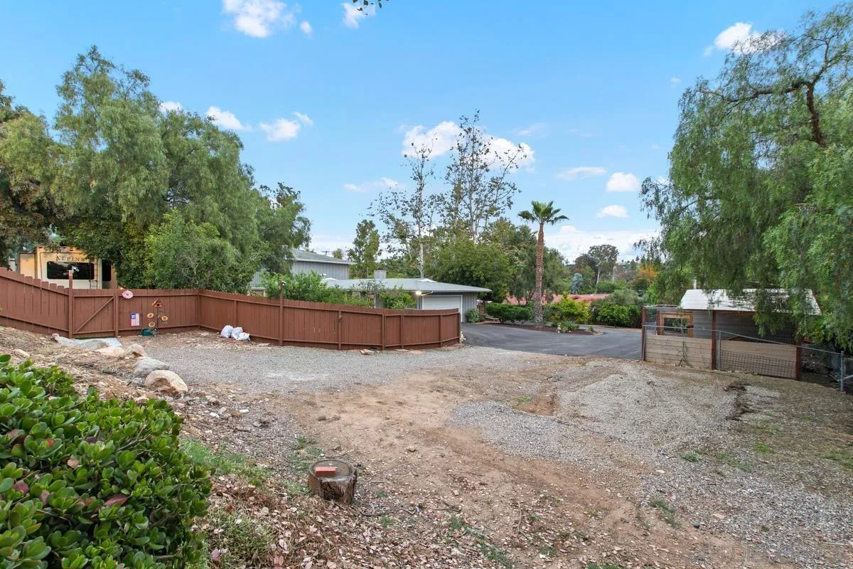 16852 Orchard Bend Road Poway, CA 92064 - Photo 34 of 39 a backyard of a house with table and chairs