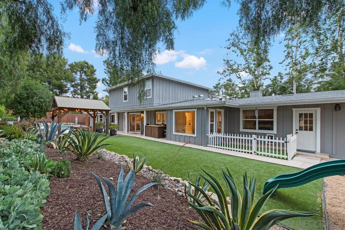 16852 Orchard Bend Road Poway, CA 92064 - Photo 35 of 39 a front view of a house with a garden