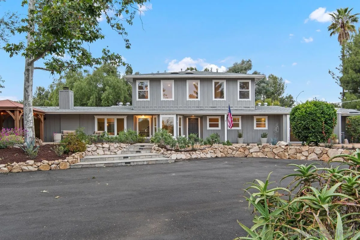 16852 Orchard Bend Road Poway, CA 92064 - Photo 4 of 39 a front view of a house with a yard