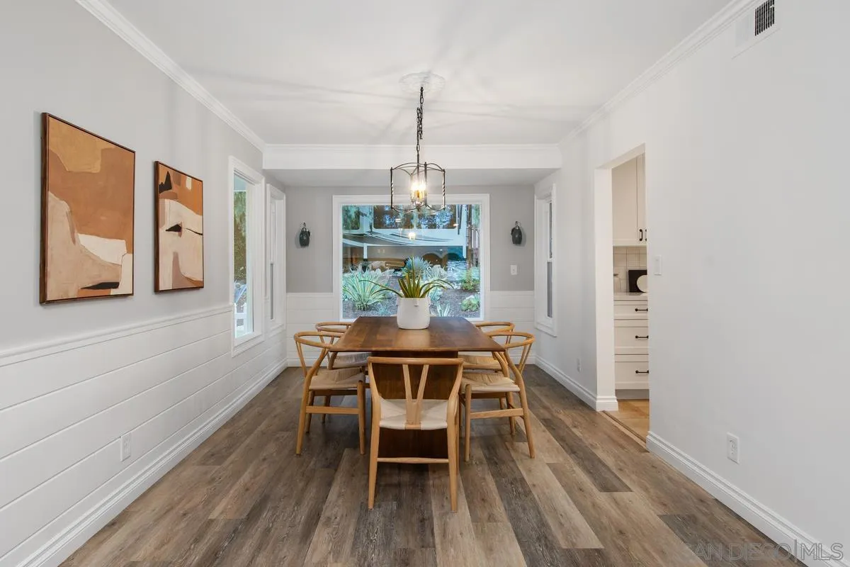 16852 Orchard Bend Road Poway, CA 92064 - Photo 10 of 39 a dining room with furniture a chandelier and wooden floor