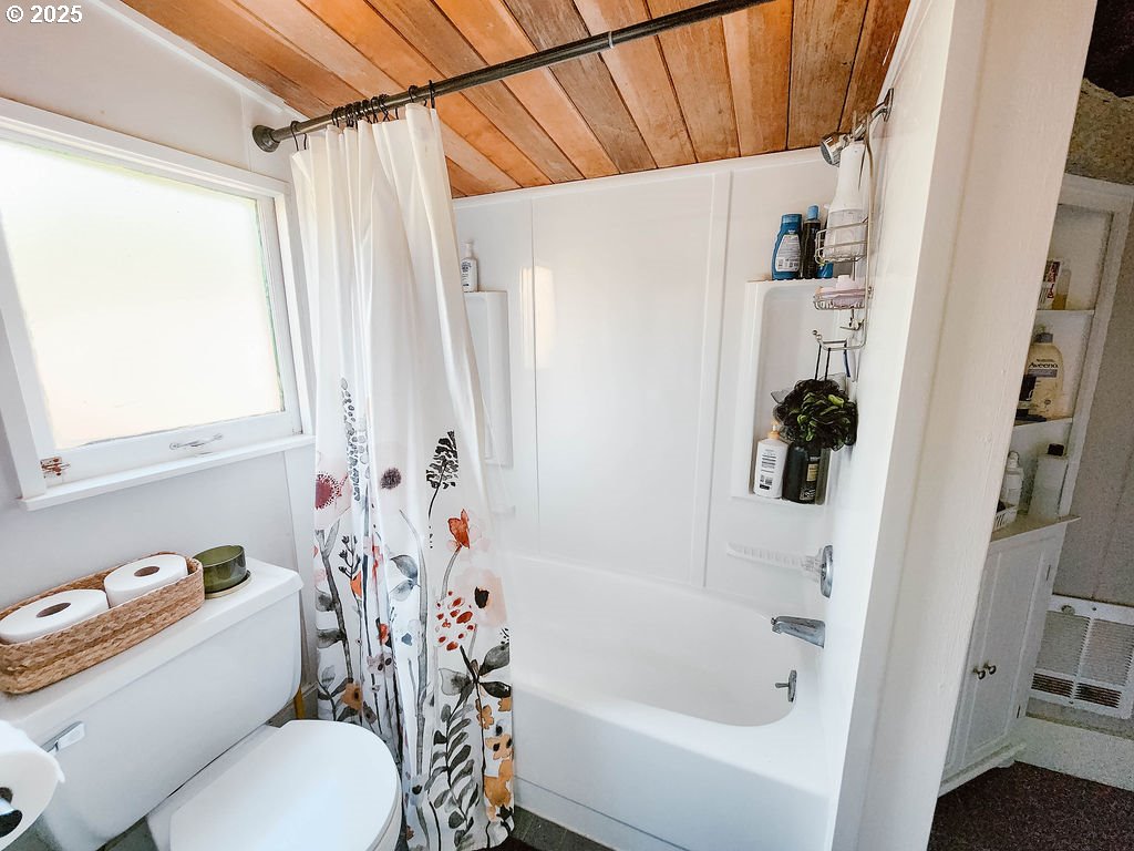 1895 City View Street Eugene, OR 97405 - Photo 15 of 36 a bathroom with a sink a toilet and a bathtub