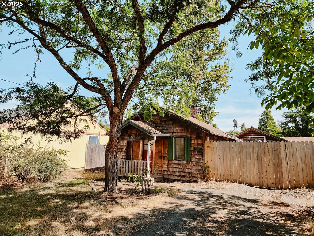 1895 City View Street Eugene, OR 97405 - Photo 2 of 36 a view of a small house with a tree in the background