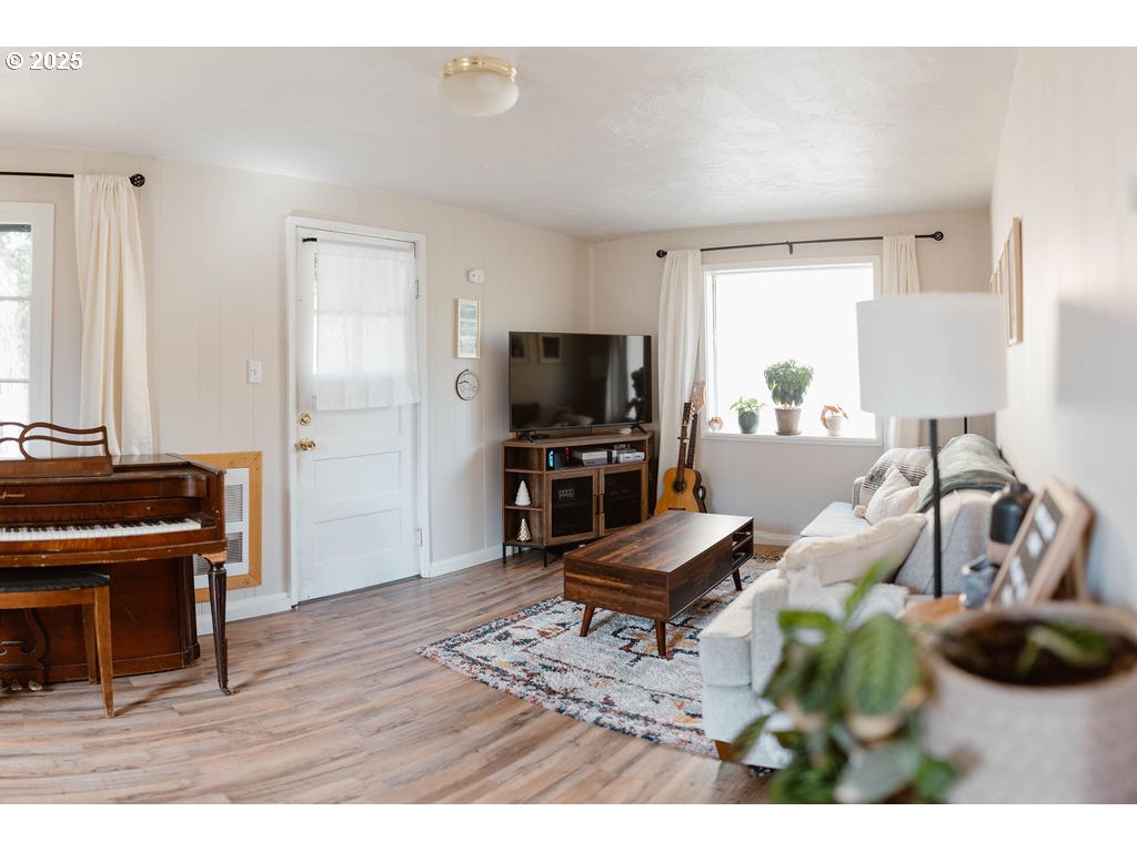 1895 City View Street Eugene, OR 97405 - Photo 6 of 36 a living room with furniture and a flat screen tv