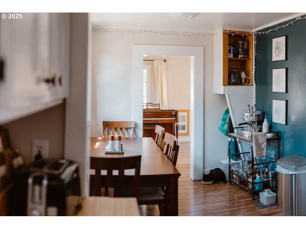 1895 City View Street Eugene, OR 97405 - Photo 8 of 36 a living room with furniture and wooden floor