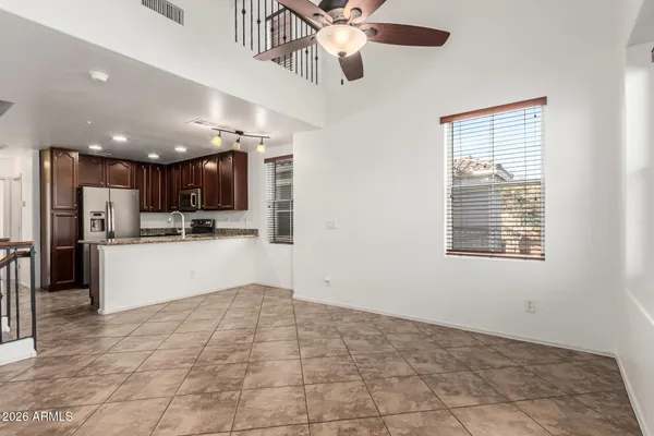 a view of kitchen with refrigerator and window