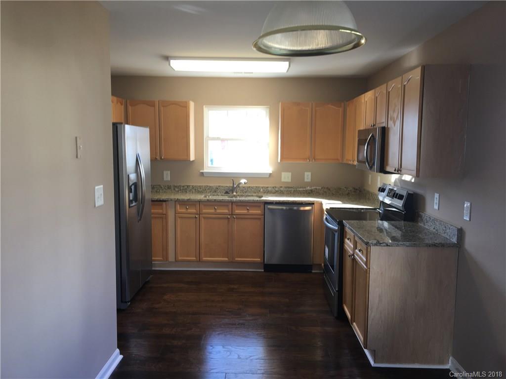 1119 Hannah Rae Court Charlotte, NC 28214 - Photo 2 of 12 a kitchen with stainless steel appliances granite countertop a sink stove and refrigerator