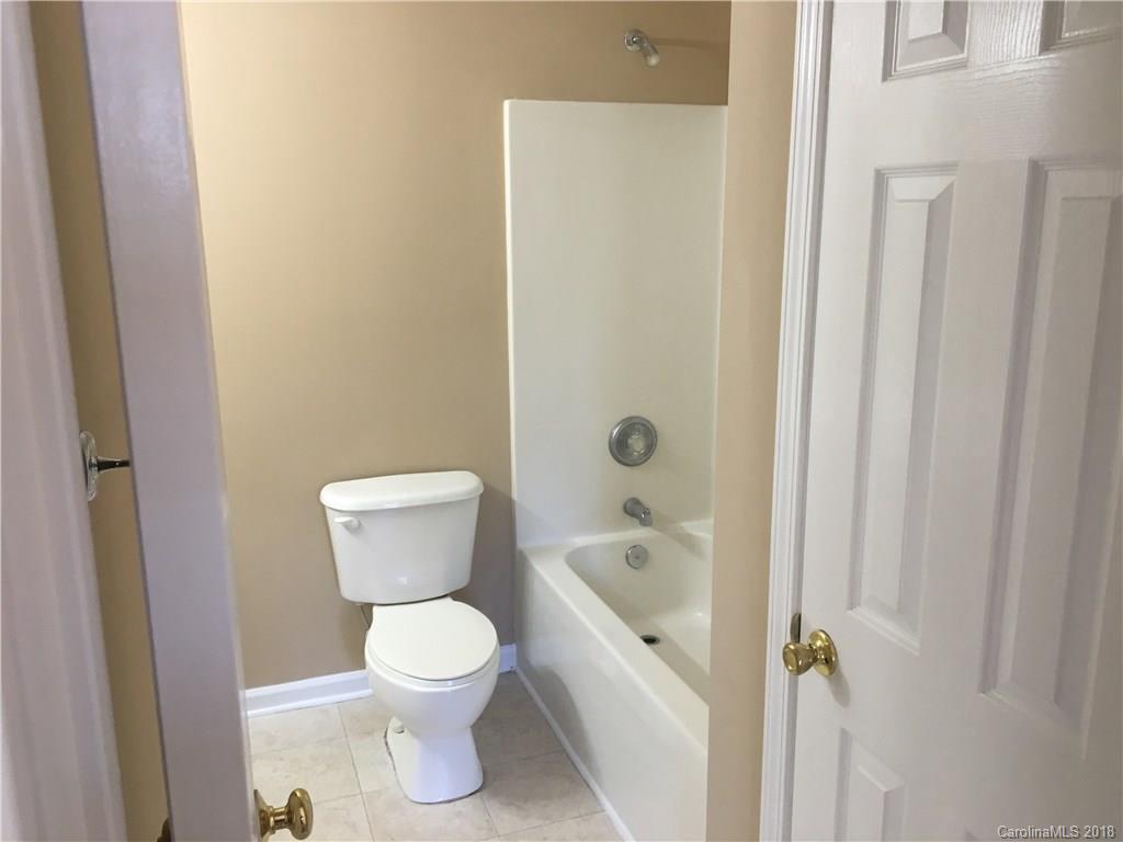 1119 Hannah Rae Court Charlotte, NC 28214 - Photo 11 of 12 a bathroom with a toilet and a shower
