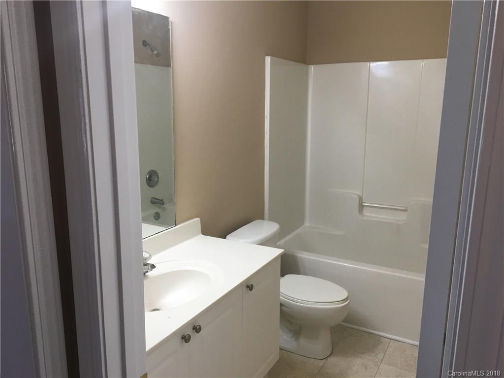 1119 Hannah Rae Court Charlotte, NC 28214 - Photo 3 of 12 a bathroom with a sink a toilet and shower
