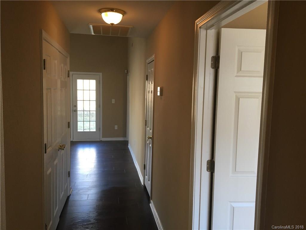 1119 Hannah Rae Court Charlotte, NC 28214 - Photo 7 of 12 a view of a hallway with wooden floor and windows