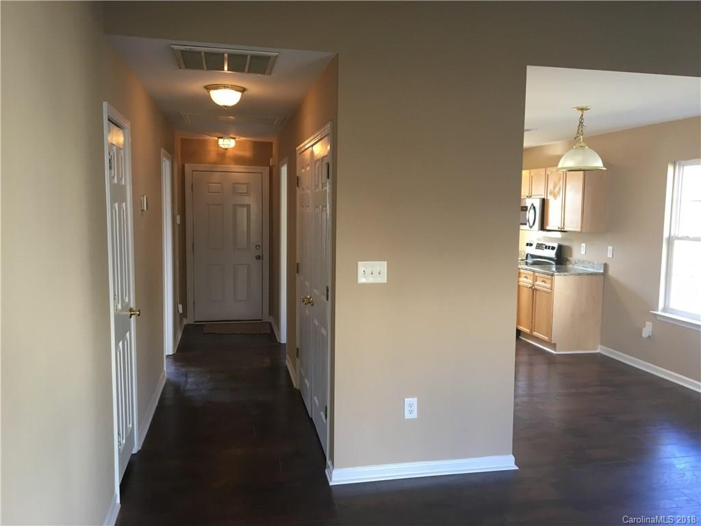 1119 Hannah Rae Court Charlotte, NC 28214 - Photo 8 of 12 a view of a hallway with wooden floor
