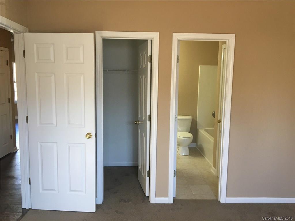 1119 Hannah Rae Court Charlotte, NC 28214 - Photo 10 of 12 a view of a bathroom with toilet shower and a sink