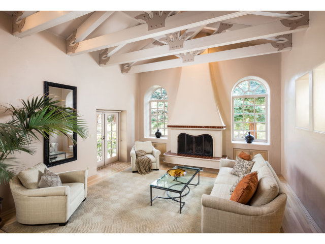 953 Roble Ridge Road Palo Alto, CA 94306 - Photo 4 of 7 a living room with furniture and a fireplace