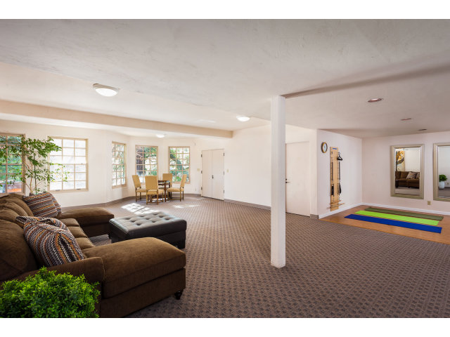 953 Roble Ridge Road Palo Alto, CA 94306 - Photo 7 of 7 a living room with furniture and a flat screen tv