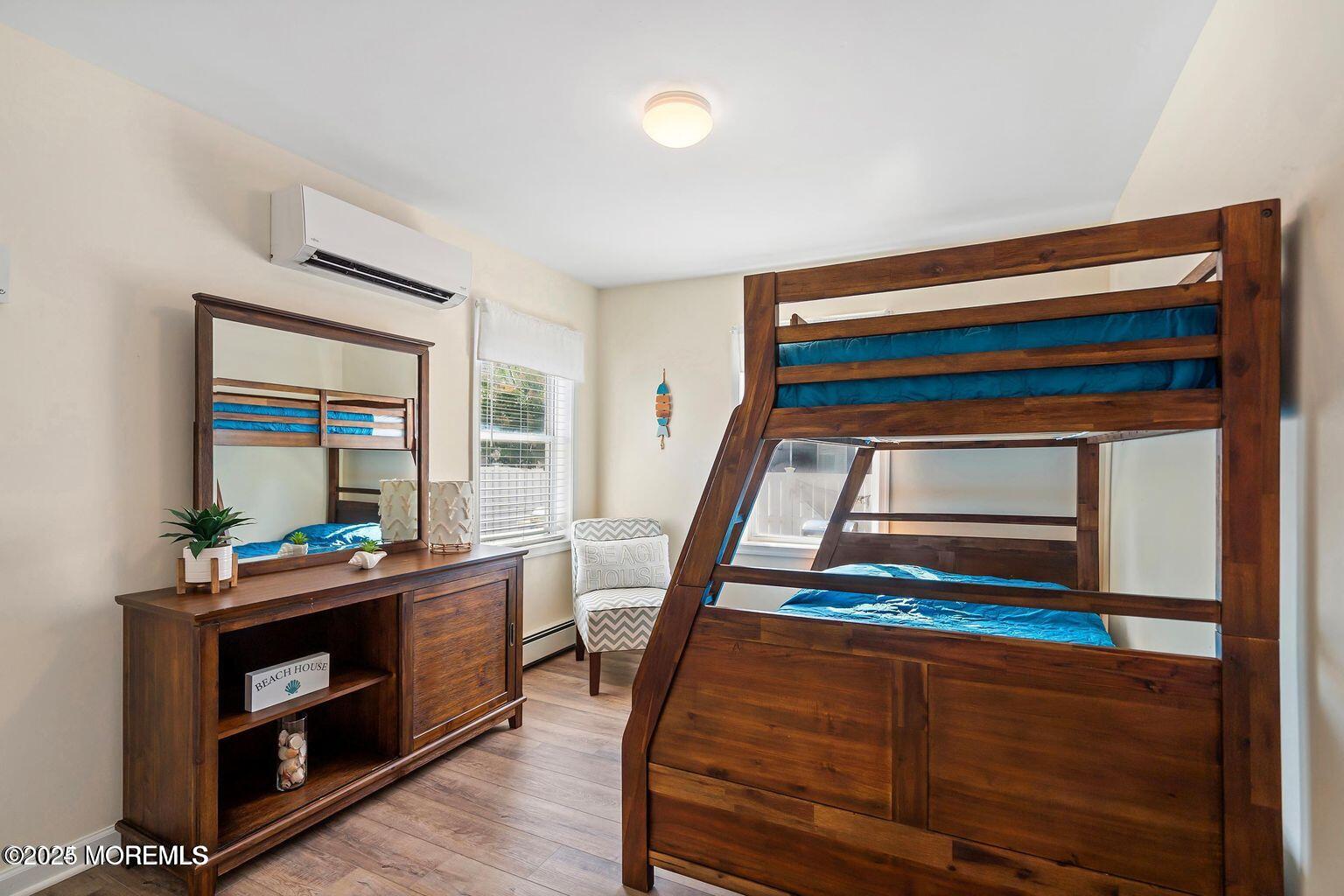 115-117 Coolidge Avenue Seaside Heights, NJ 08751 - Photo 16 of 25 a bedroom with a bed and a window