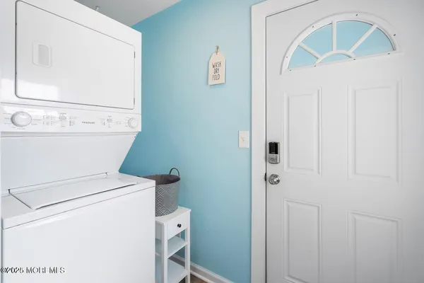 a bathroom with a toilet a sink and a mirror