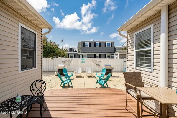 a view of a dinning tables and chairs in patio