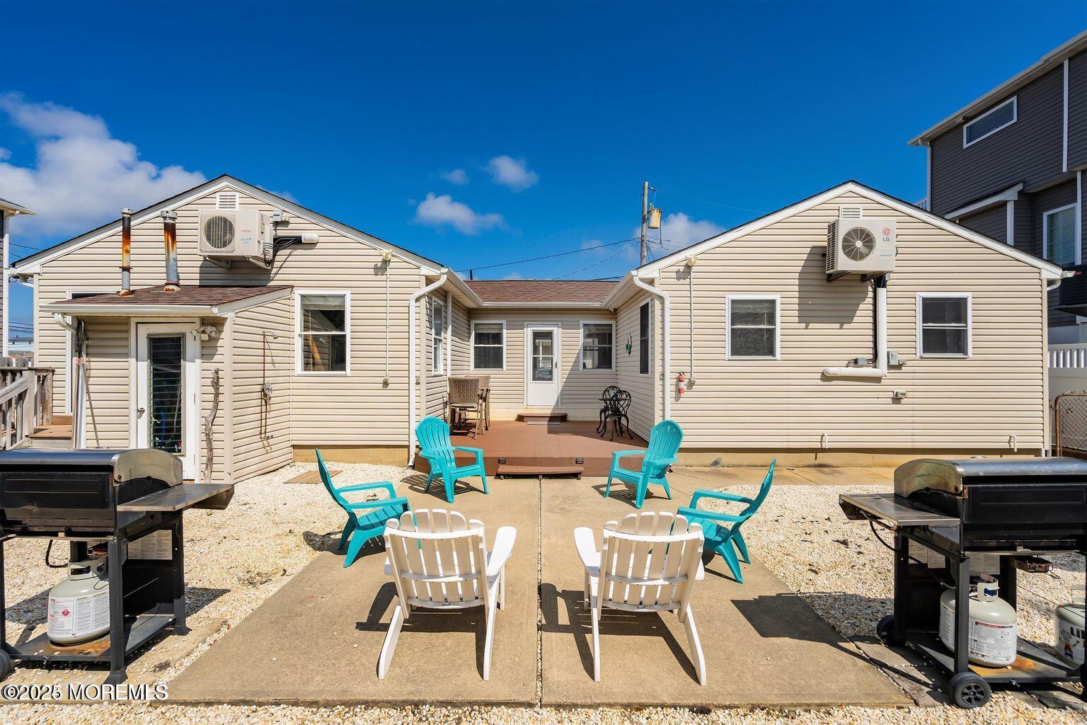 115-117 Coolidge Avenue Seaside Heights, NJ 08751 - Photo 23 of 25 a view of a dinning table and chairs in patio of the house