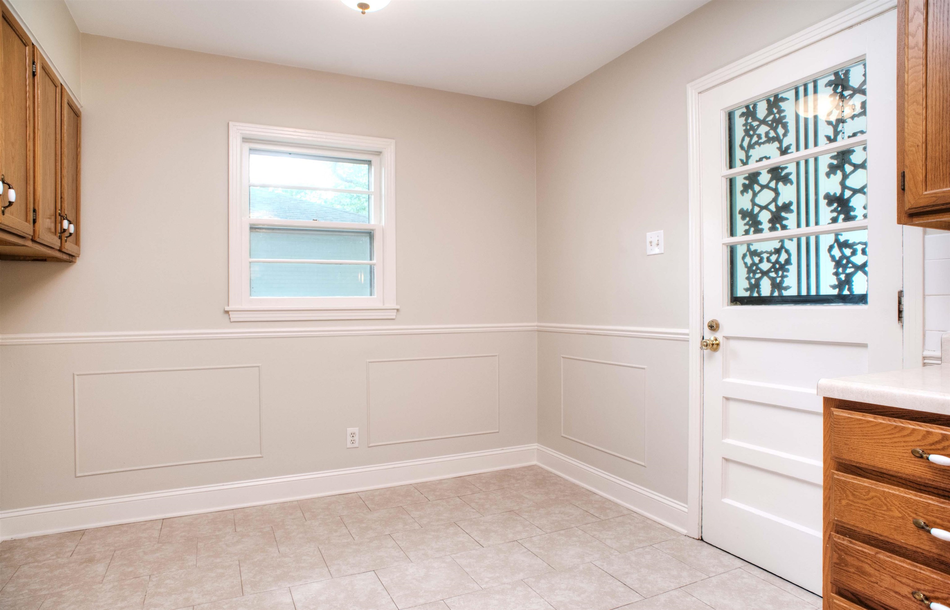 5221 Sequoia Road Memphis, TN 38120 - Photo 8 of 20 a view of an empty room with a window