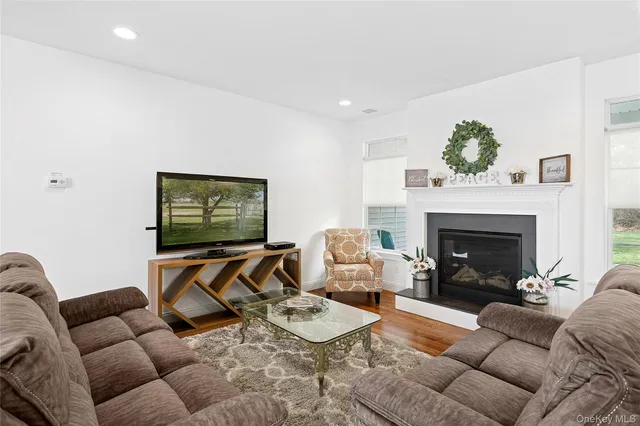 a bathroom with a granite countertop sink a toilet and bathtub