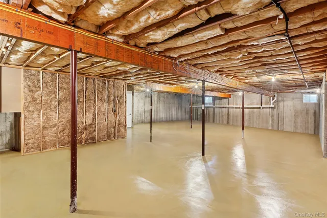 a view of a room with wooden walls