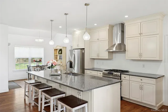 a kitchen with counter top space appliances and cabinets