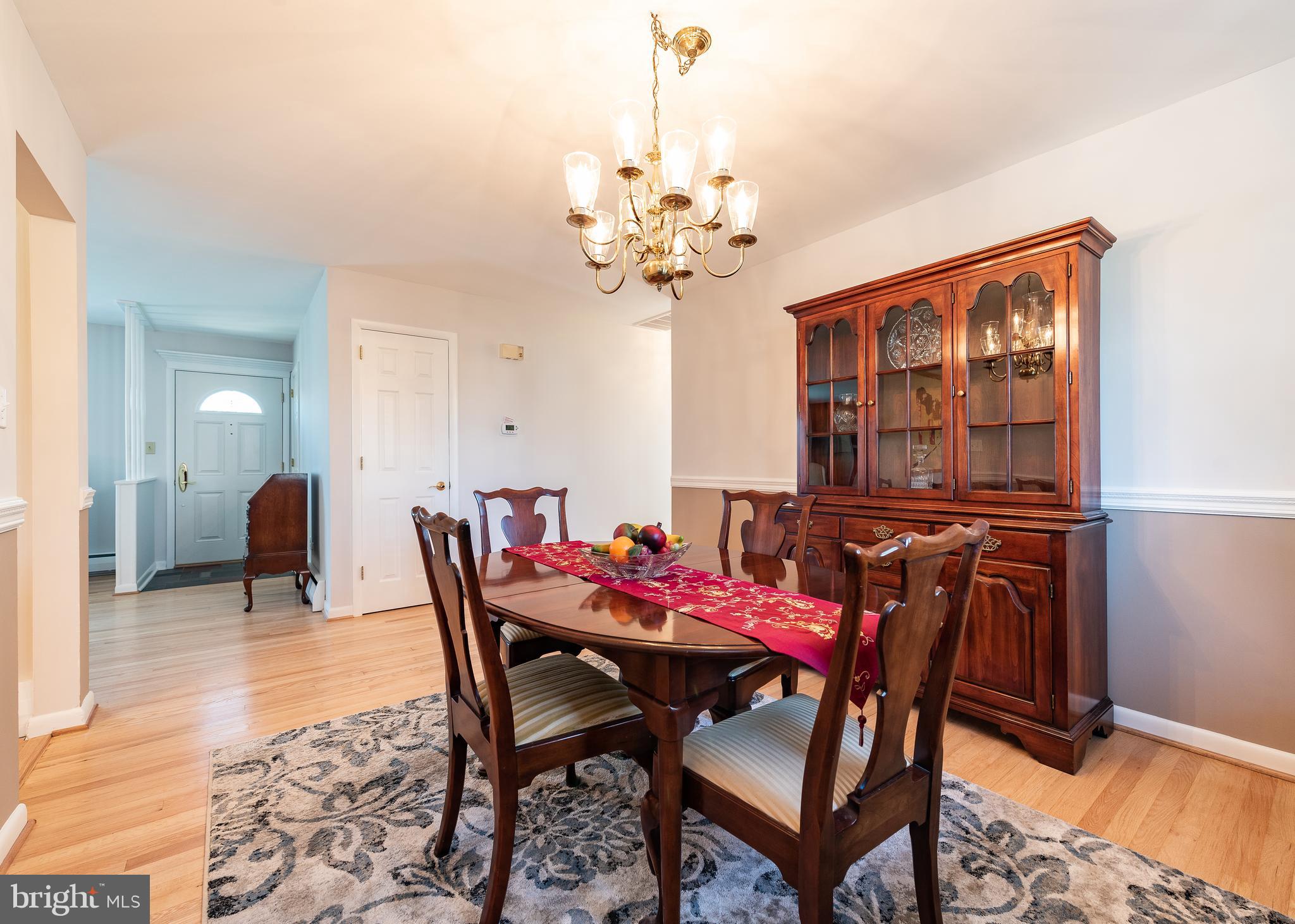 2826 Pinewick Road Ellicott City, MD 21042 - Photo 8 of 32 Formal dining room with gleaming hardwoods