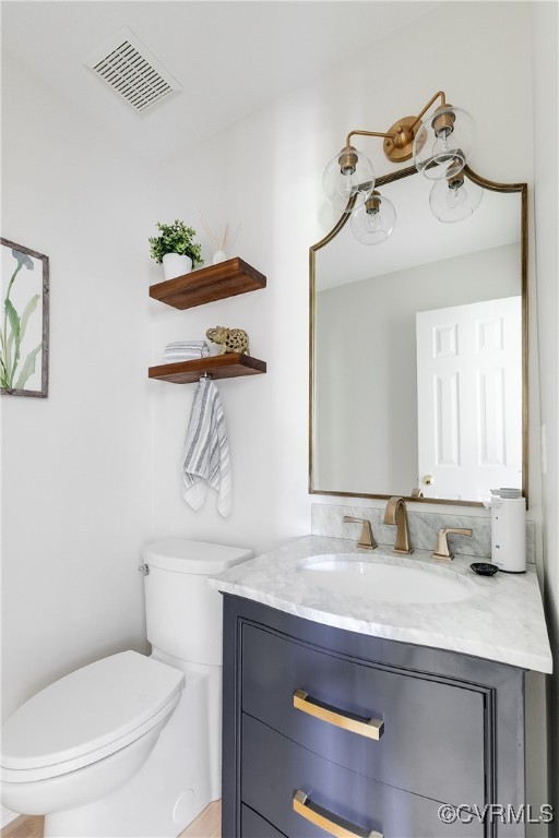 17476 Parsons Ridge Road Beaverdam, VA 23015 - Photo 11 of 40 a bathroom with a toilet sink and mirror