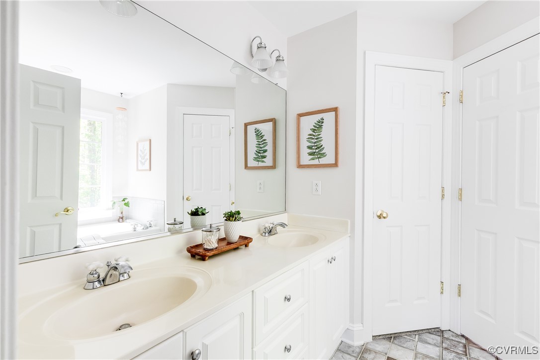 17476 Parsons Ridge Road Beaverdam, VA 23015 - Photo 25 of 40 a bathroom with a sink and a mirror