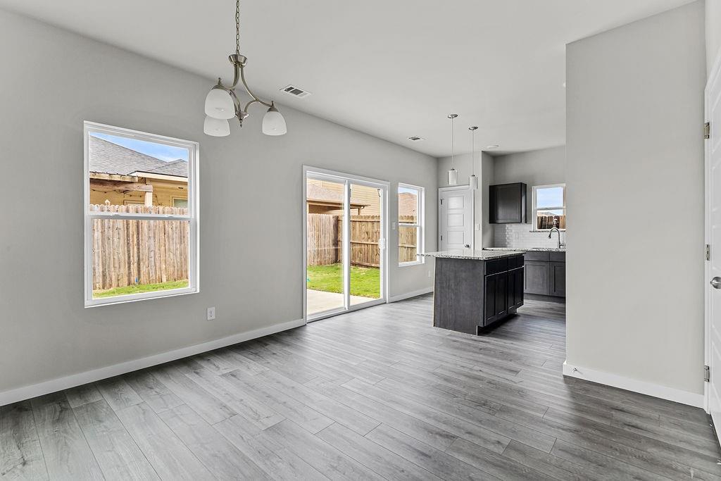 620 Alameda Road Azle, TX 76020 - Photo 5 of 27 a view of kitchen and windows