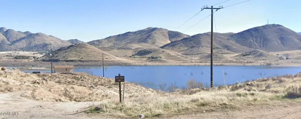 a view of a house with a snow on the mountain