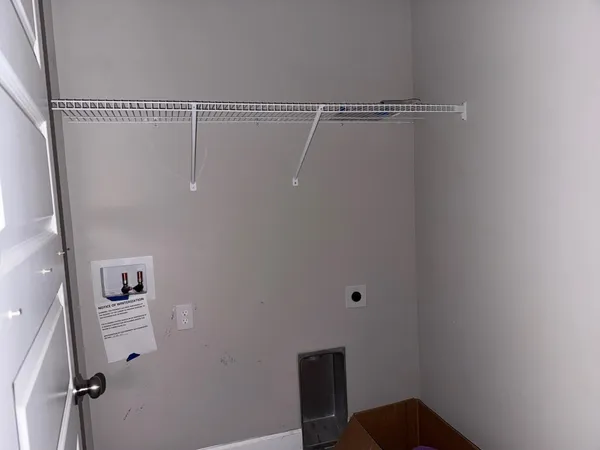 a view of small space with racks on the wall