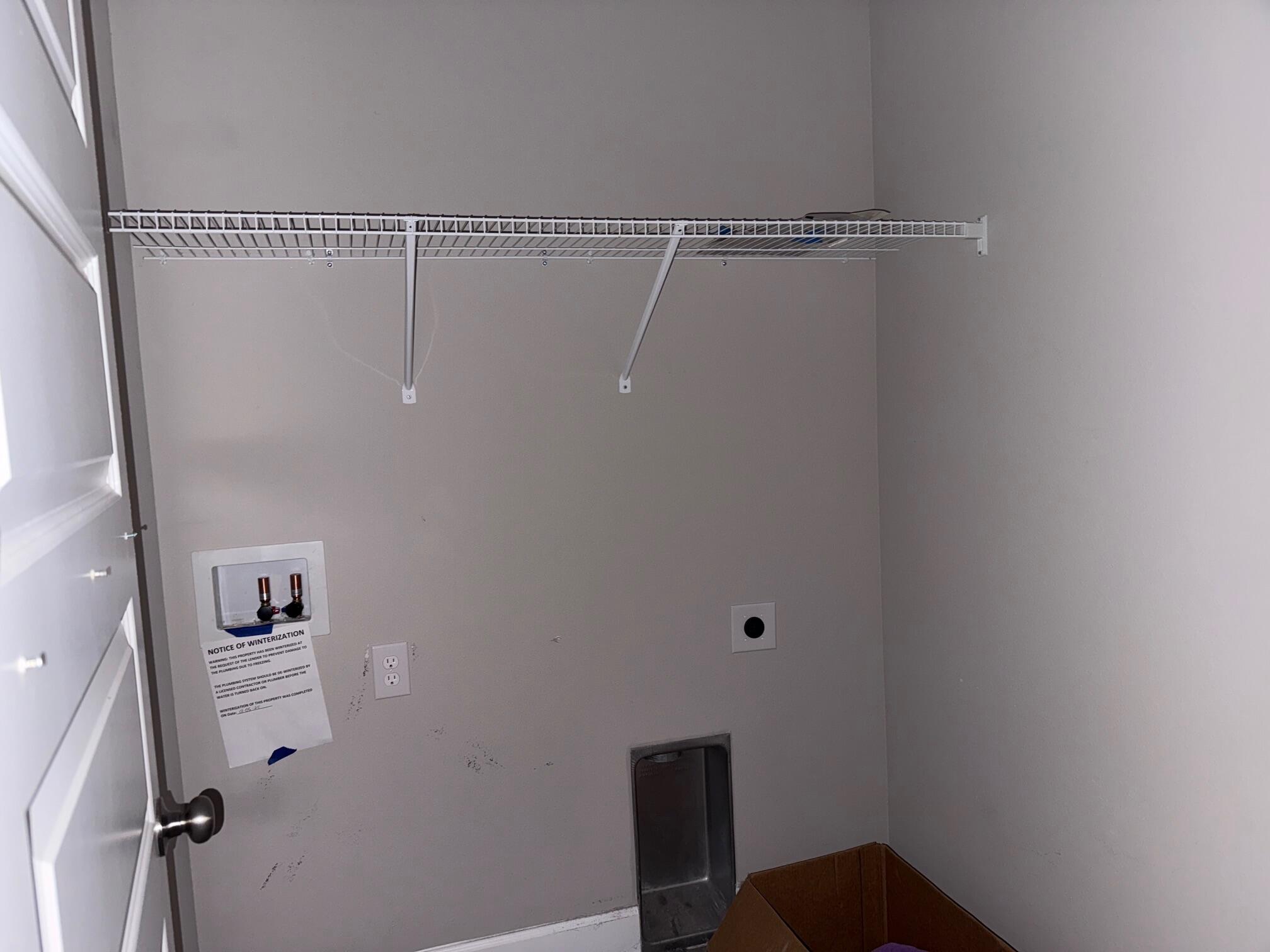 1509 Long Needle Court Baker, FL 32531 - Photo 11 of 14 a view of small space with racks on the wall