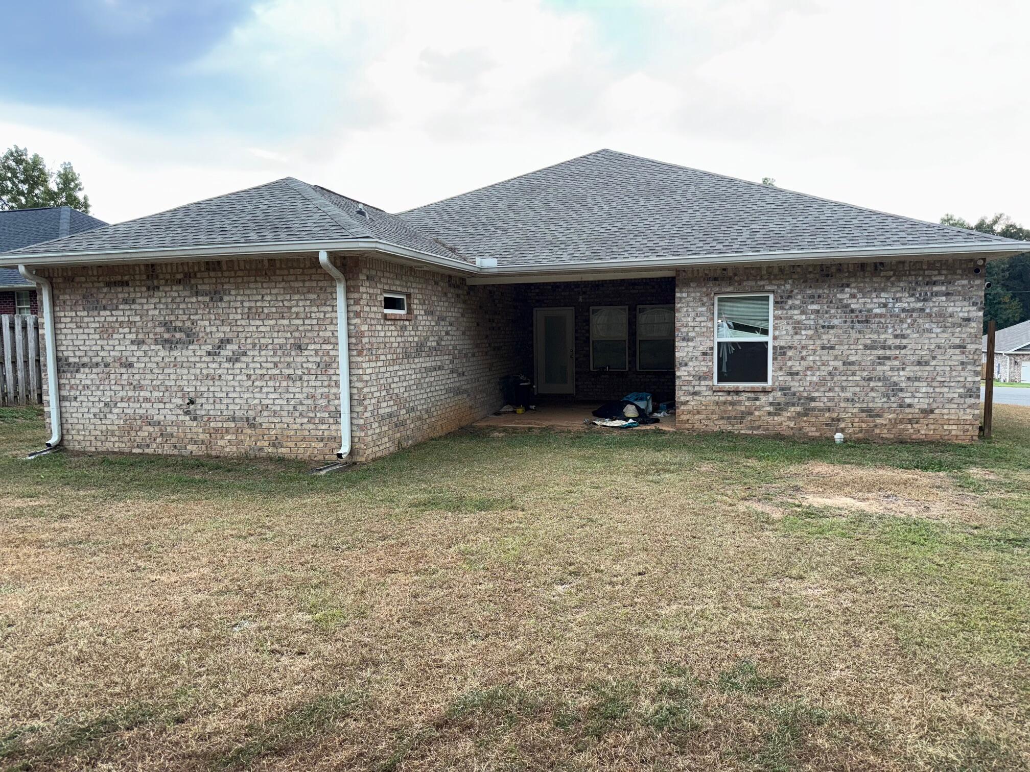 1509 Long Needle Court Baker, FL 32531 - Photo 14 of 14 a front view of a house with a yard
